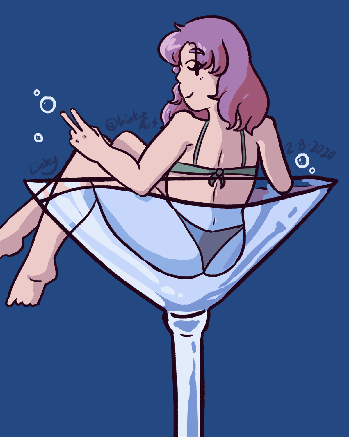 Phera sitting in a martini glass.